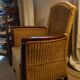 comfortable colonial-style armchair in rattan and mahogany