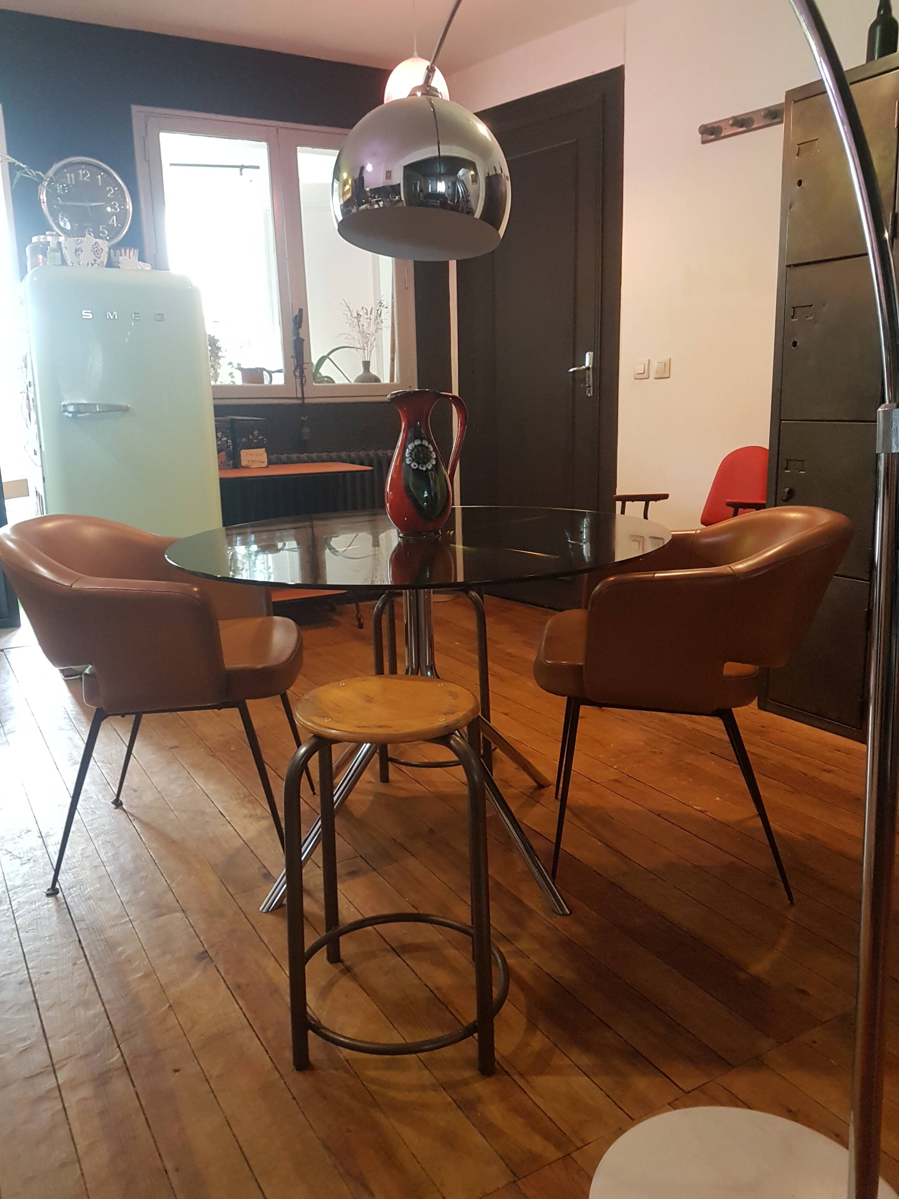 Smoked glass round table and chrome foot