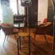 Smoked glass round table and chrome foot