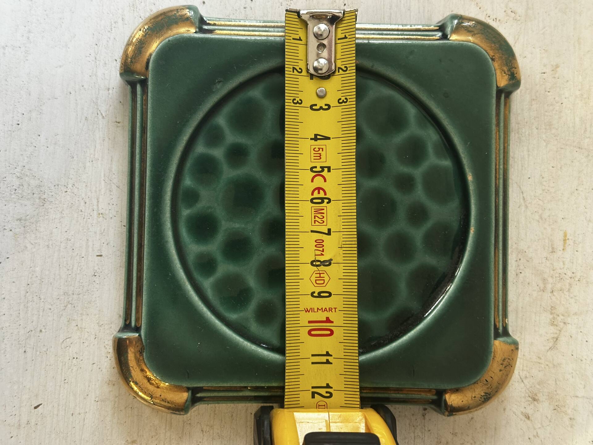 Art Deco bottle coaster in speckled green glazed ceramic and