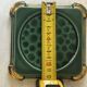 Art Deco bottle coaster in speckled green glazed ceramic and