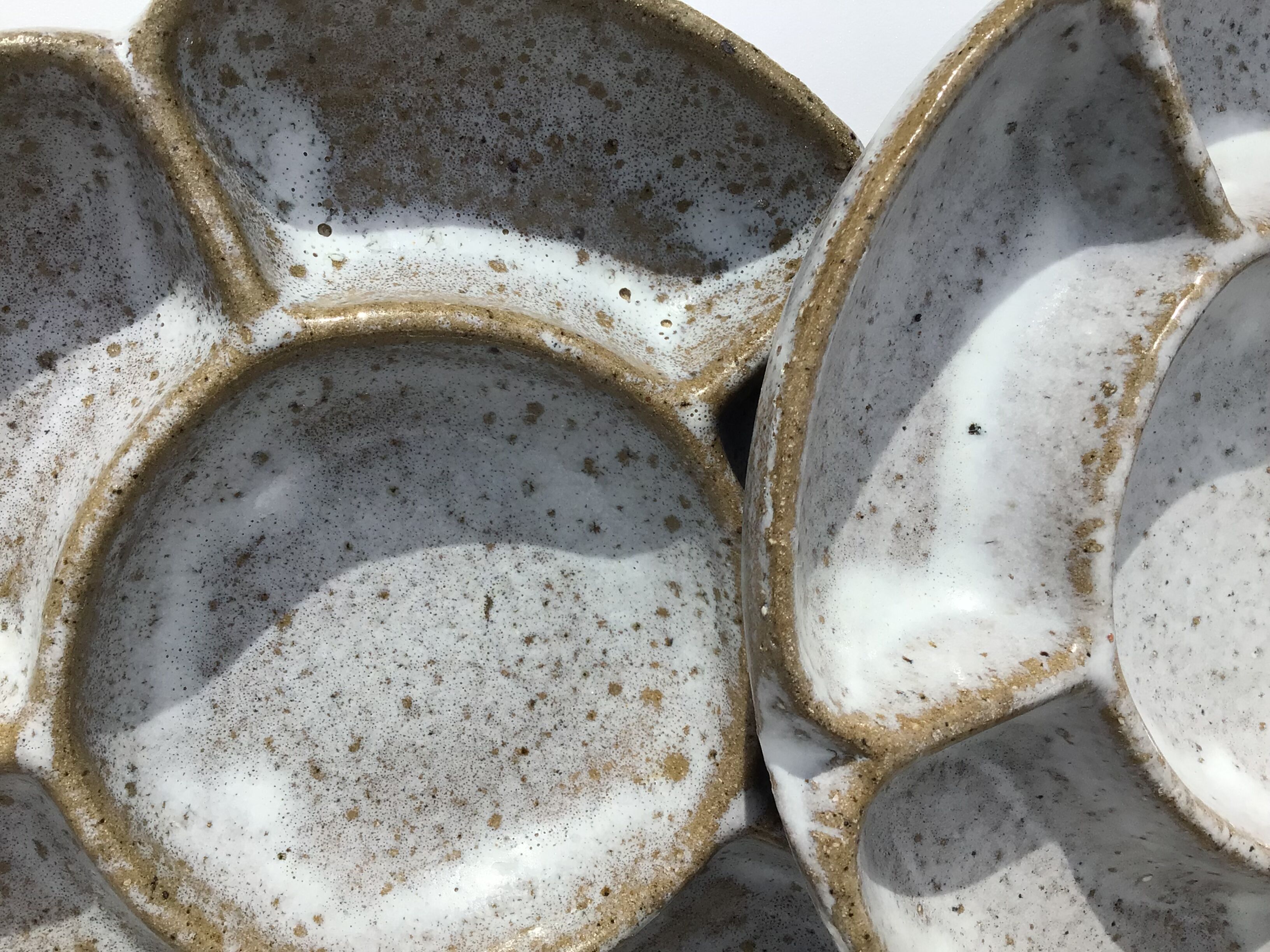 4 White compartmentalized handmade stoneware plates