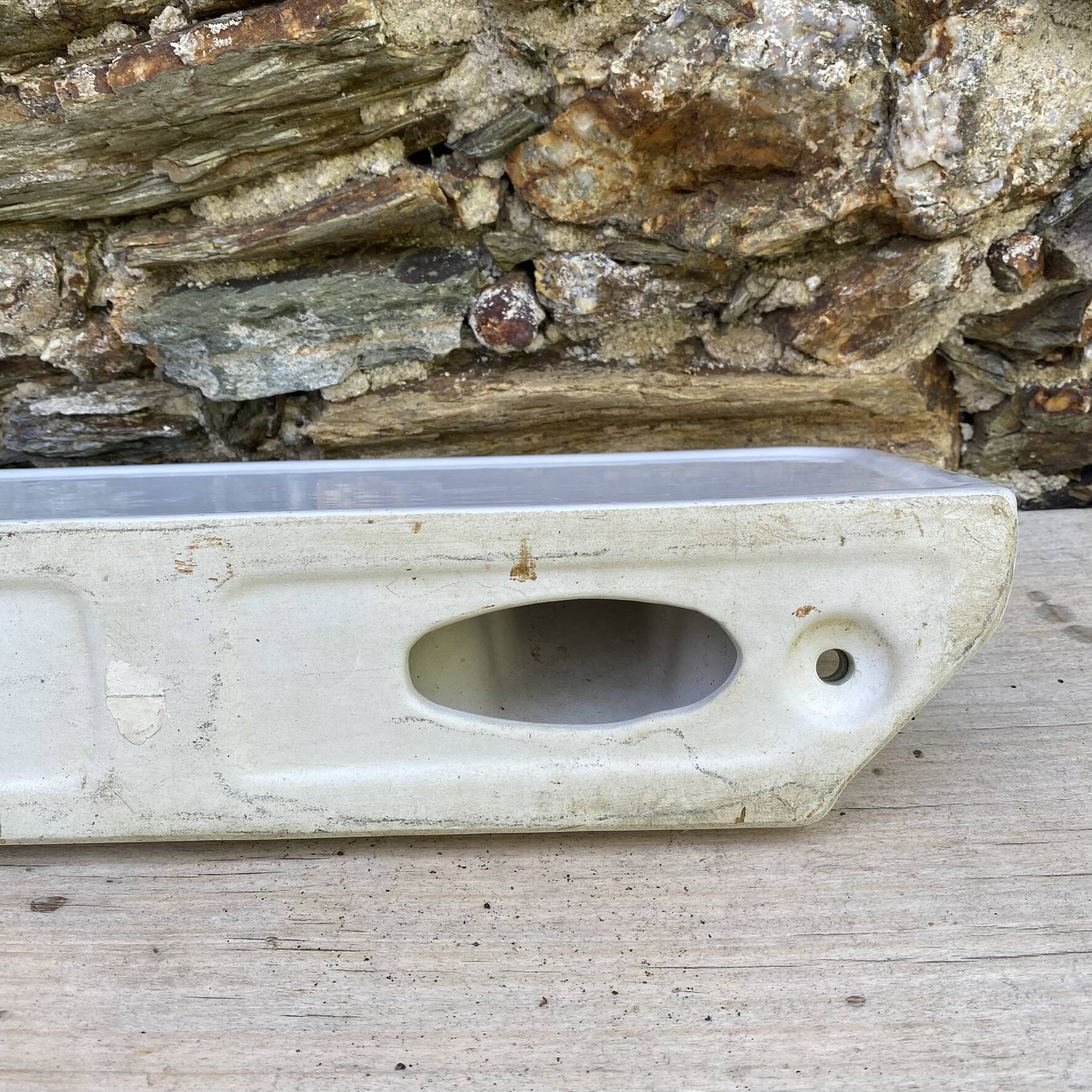 Antique wall shelf for bathroom in white porcelain.
