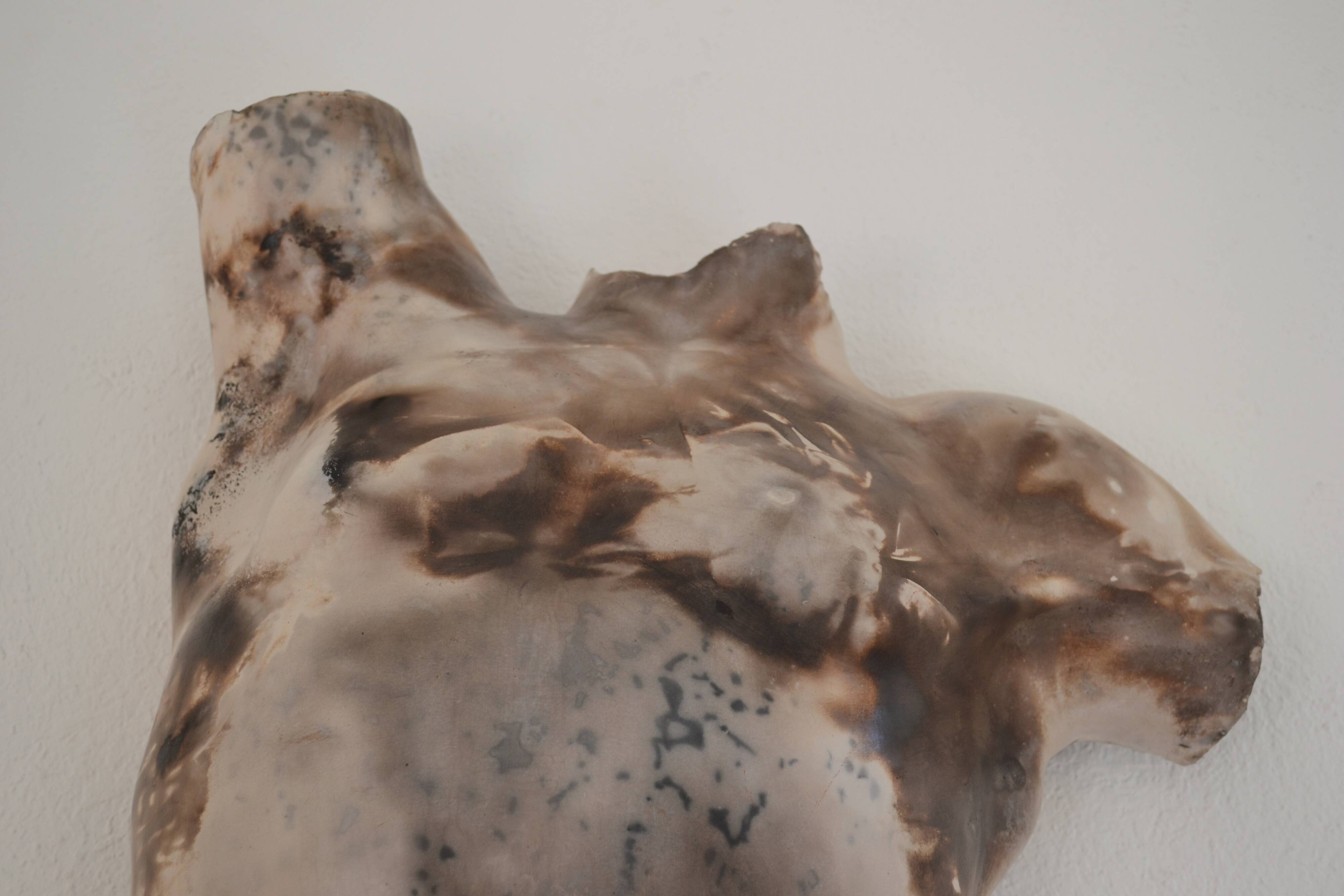 Male torso sculpture by patinated casting, signed to be identified.