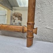 Vintage wooden mirror imitating bamboo
