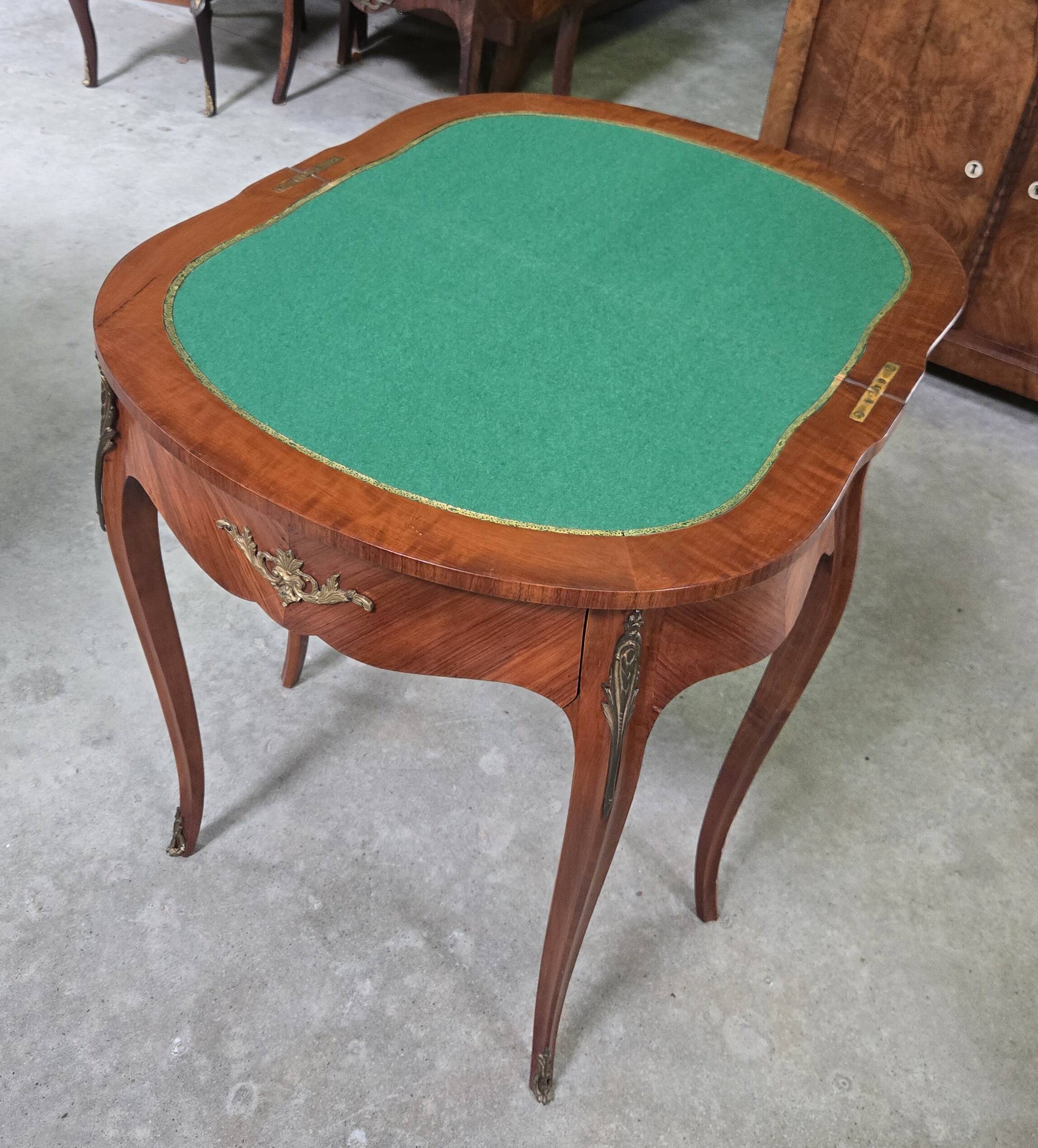Half-moon gaming table in Louis XV style, made of precious wood marquetry.