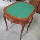 Half-moon gaming table in Louis XV style, made of precious wood marquetry.