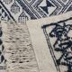 Traditional white and blue hand-woven wool carpet