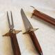 Vintage cutting service with knife and fork in wooden sheath