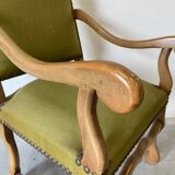 Olive green upholstered armchairs with studs