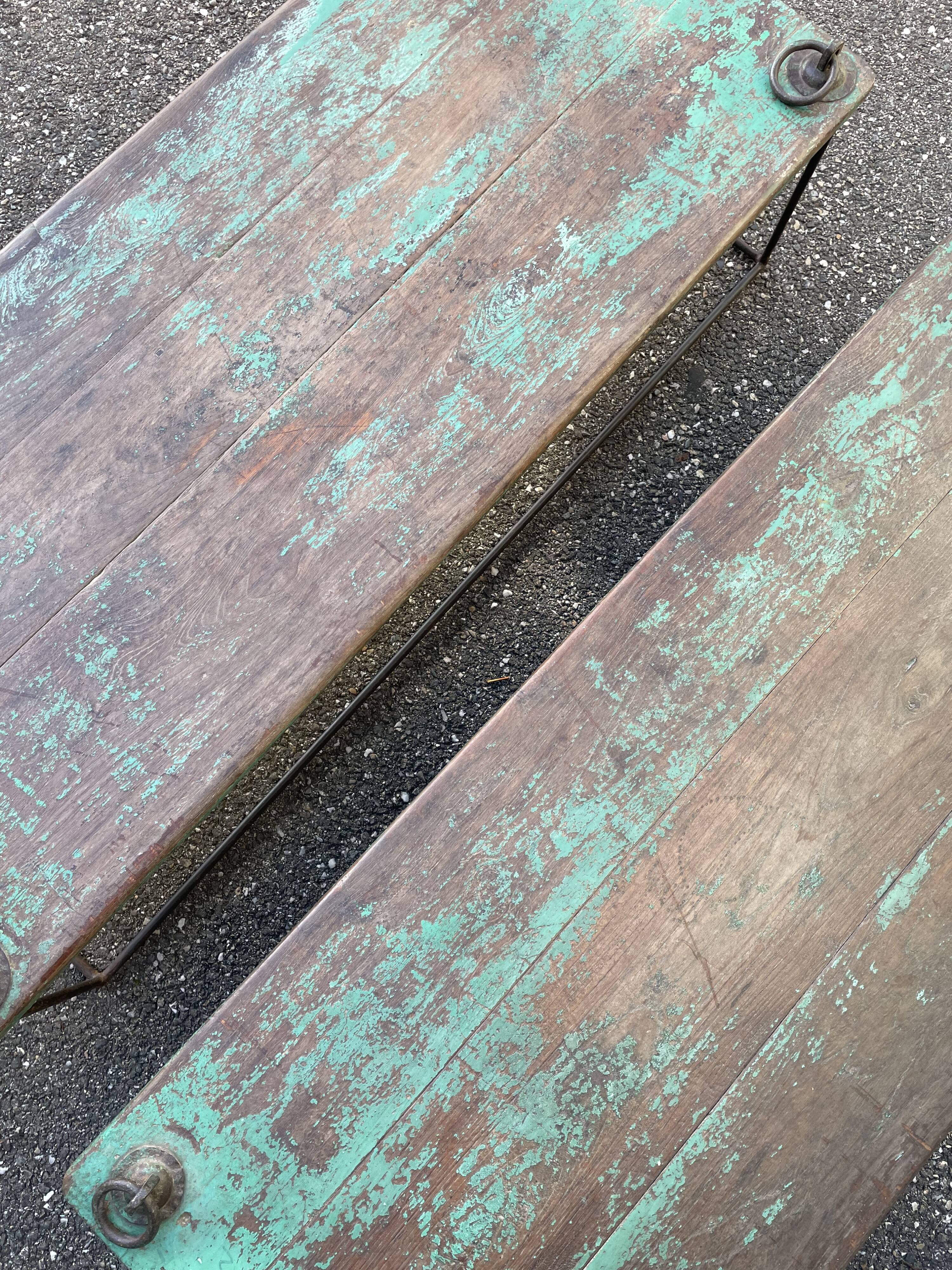 Pair of green teak coffee tables.