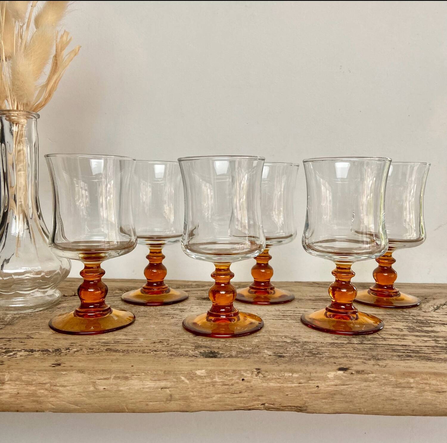 6 small amber stemmed glasses