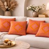 Set of 4 embroidered cushions in coral and pink – 44x44 cm – identical on both sides.