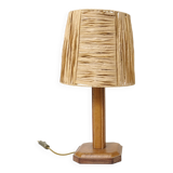 Lamp base in saddle stitched leather and raffia lampshade.