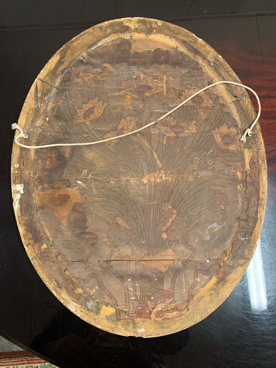Golden oval mirror