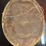 Golden oval mirror