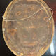 Golden oval mirror