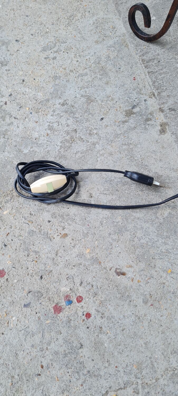 Wrought iron floor lamp and rope