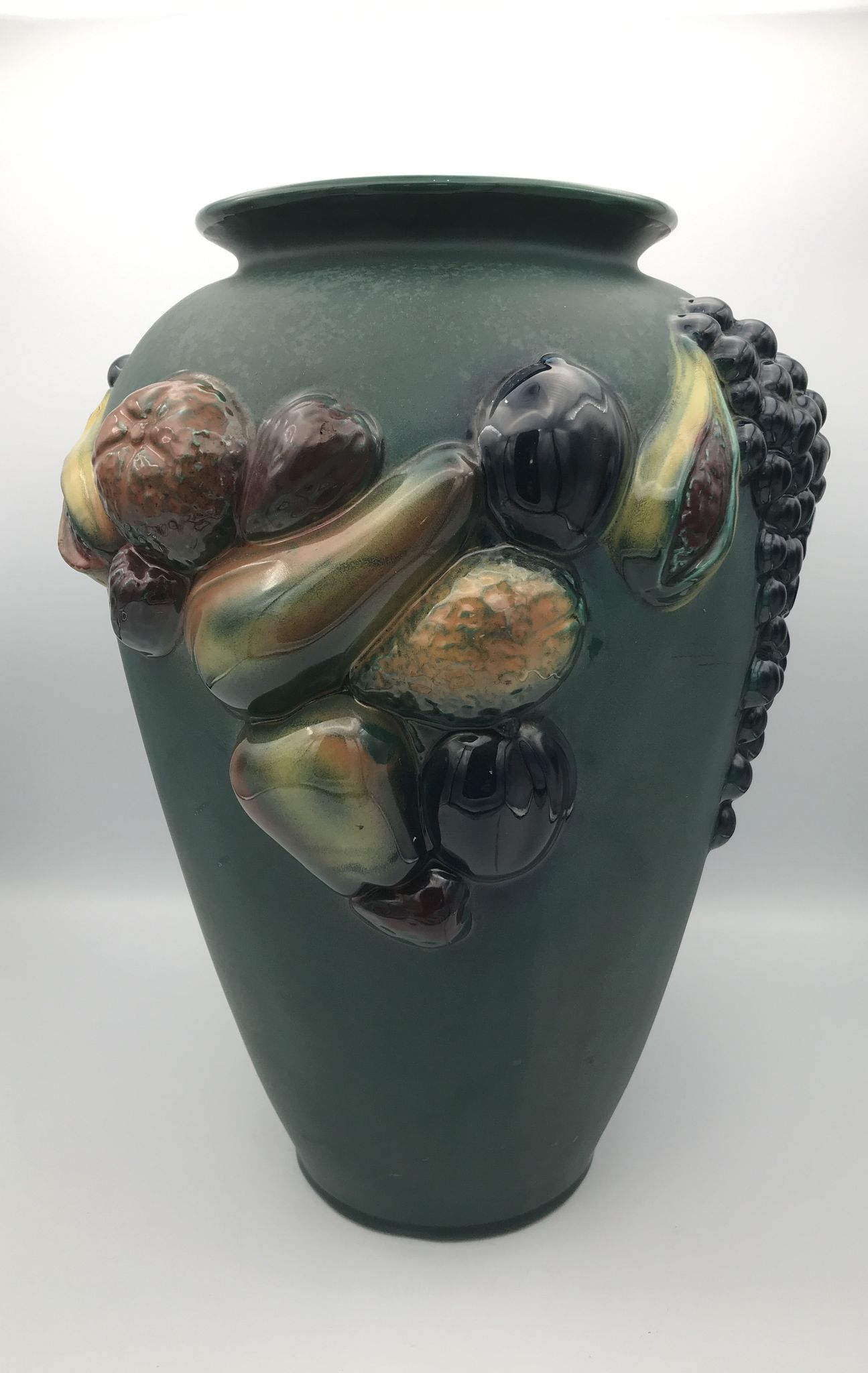 Green ceramic vase with polychrome decoration of fruits and vegetables in relief 33.5 cm