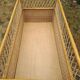 Rattan cradle.