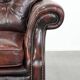 Fauteuil Chesterfield en cuir marbré rouge de style anglais