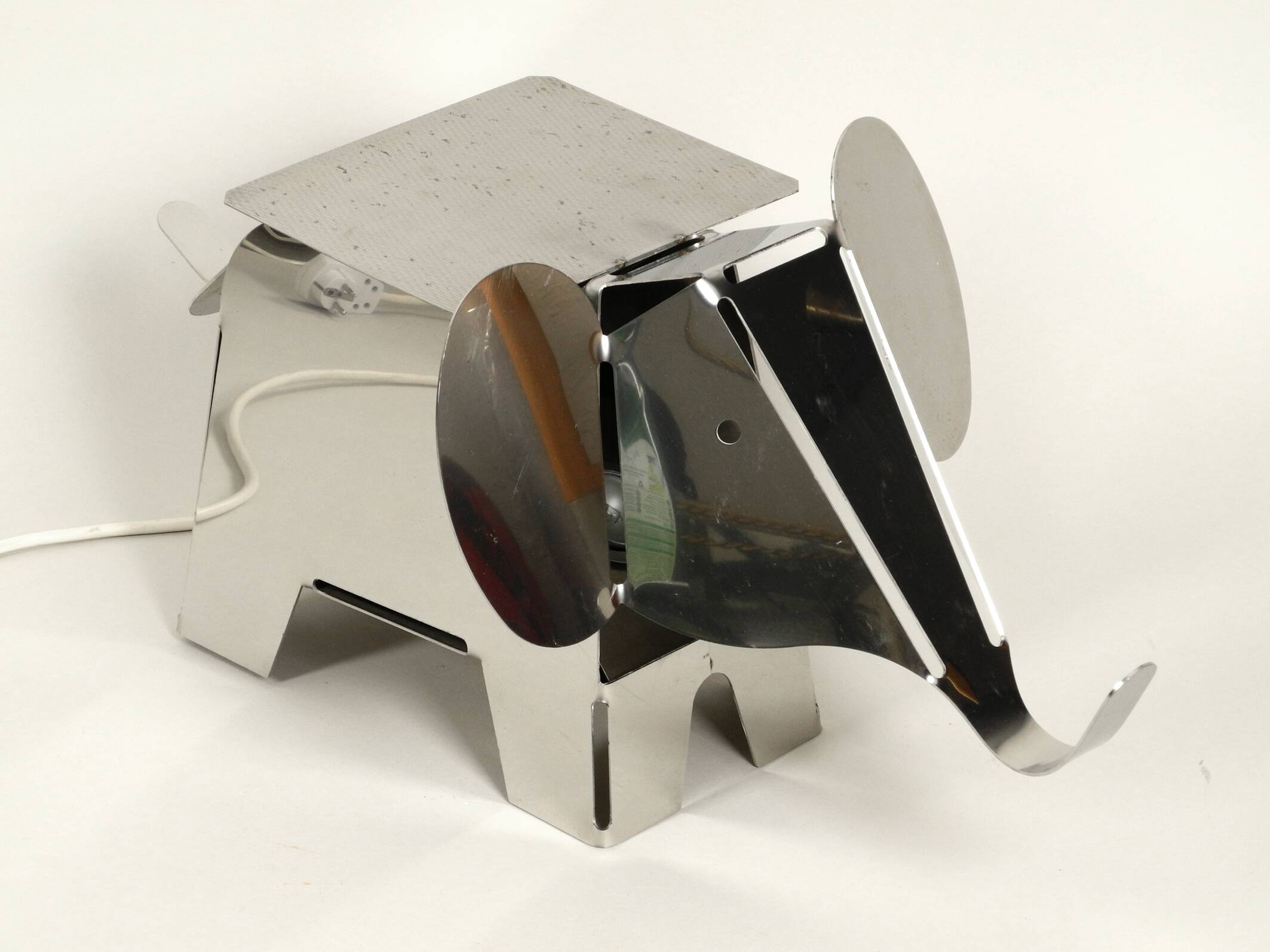 80s heavy metal chrome elephant floor lamp as side table Postmodern design