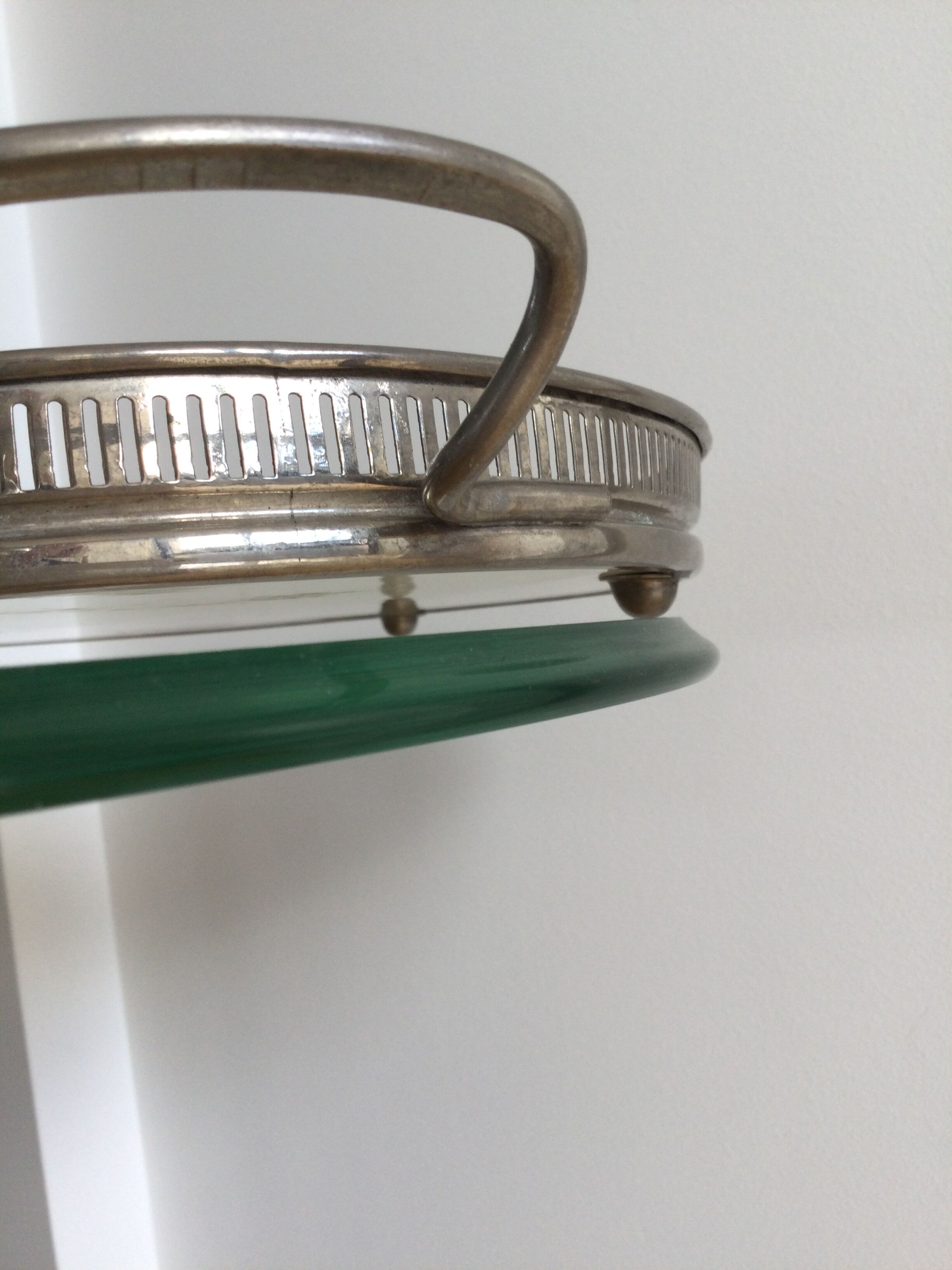 Vintage earthenware tray surrounded by antique metal