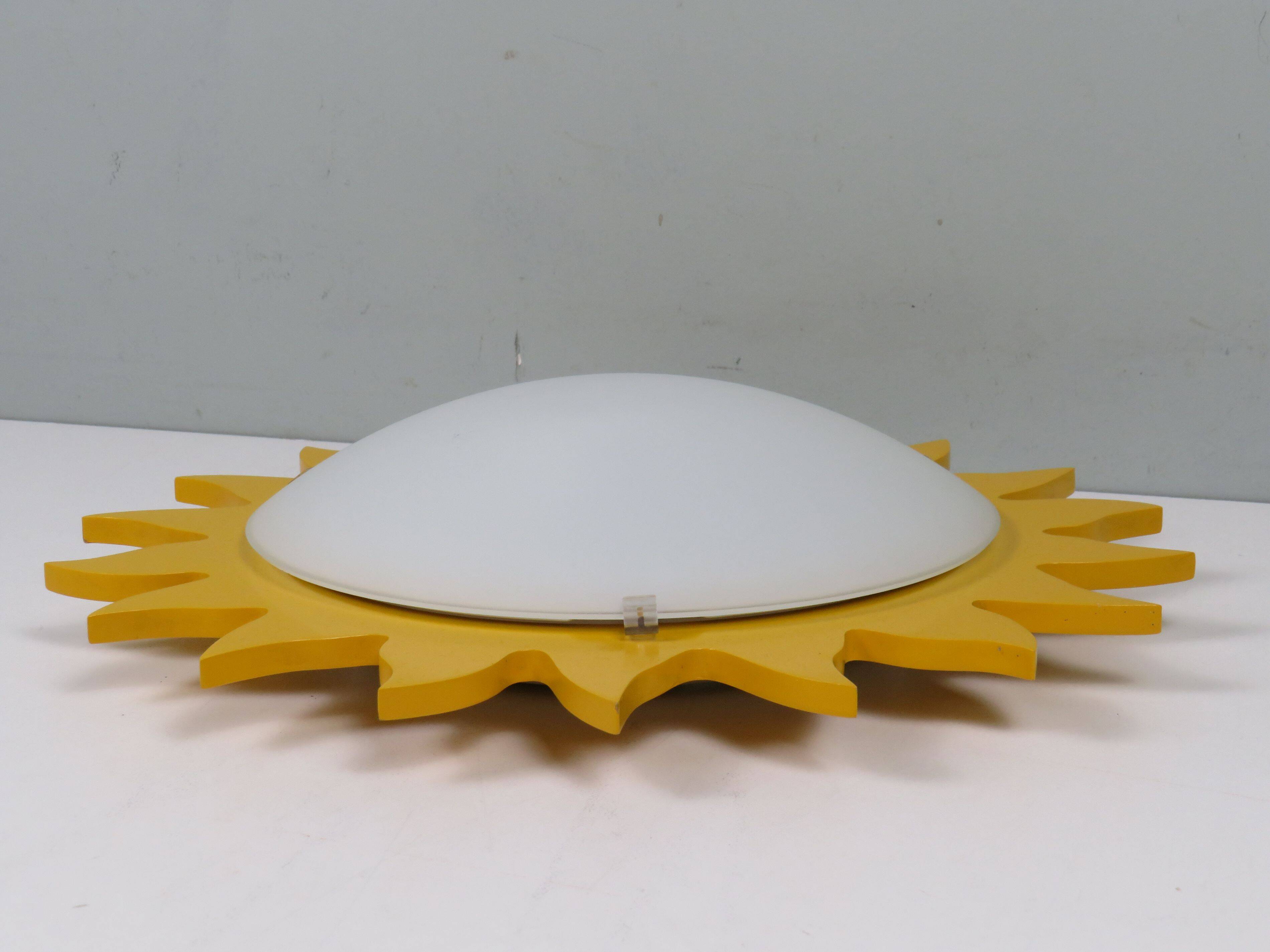 Vintage "sun" ceiling light Massive Belgium in opaline glass and lacquered wood.