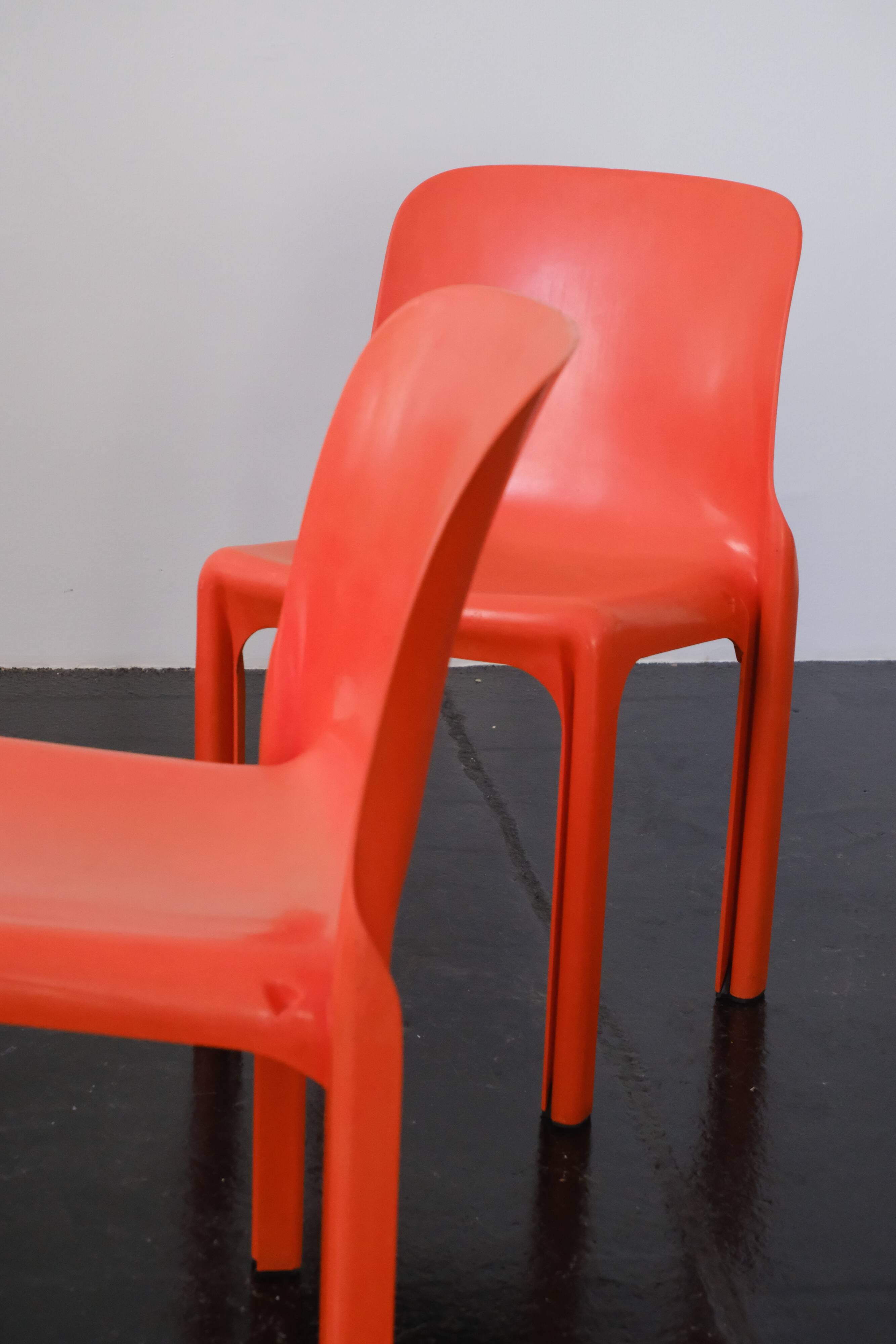 Orange "Selene" chair by Vico Magistretti / Artemide