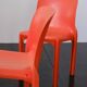 Orange "Selene" chair by Vico Magistretti / Artemide