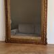 Miroir doré fin 19ème avec  fronton décoré. 150x82.