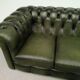 Three-seater green leather Chesterfield sofa