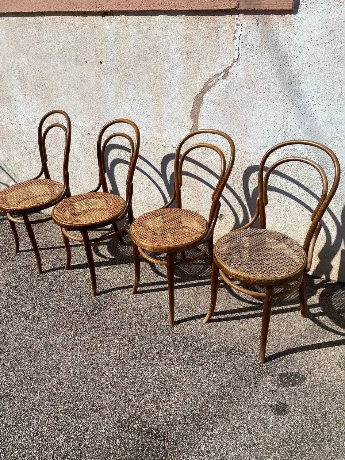 Set of 4 wooden and cane bistro chairs