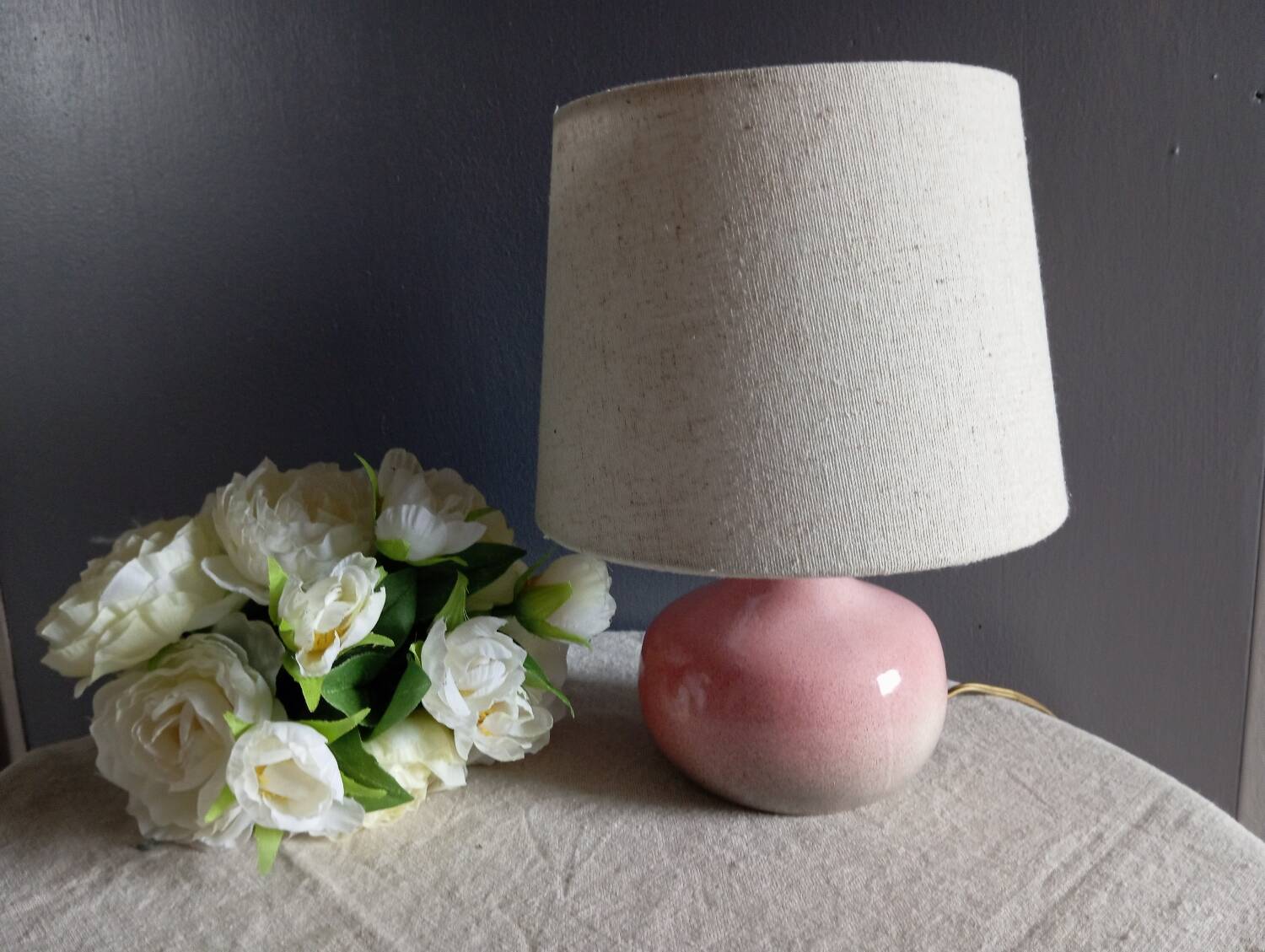 Signed speckled pink ceramic bedside lamp, linen lampshade