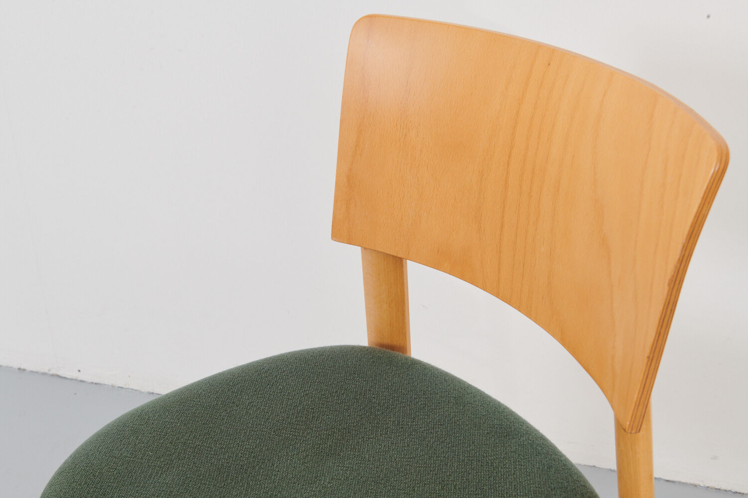 Kusch &Co chair made of wood and green fabric