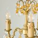 Small vintage brass chandelier with amber crystal pendants.