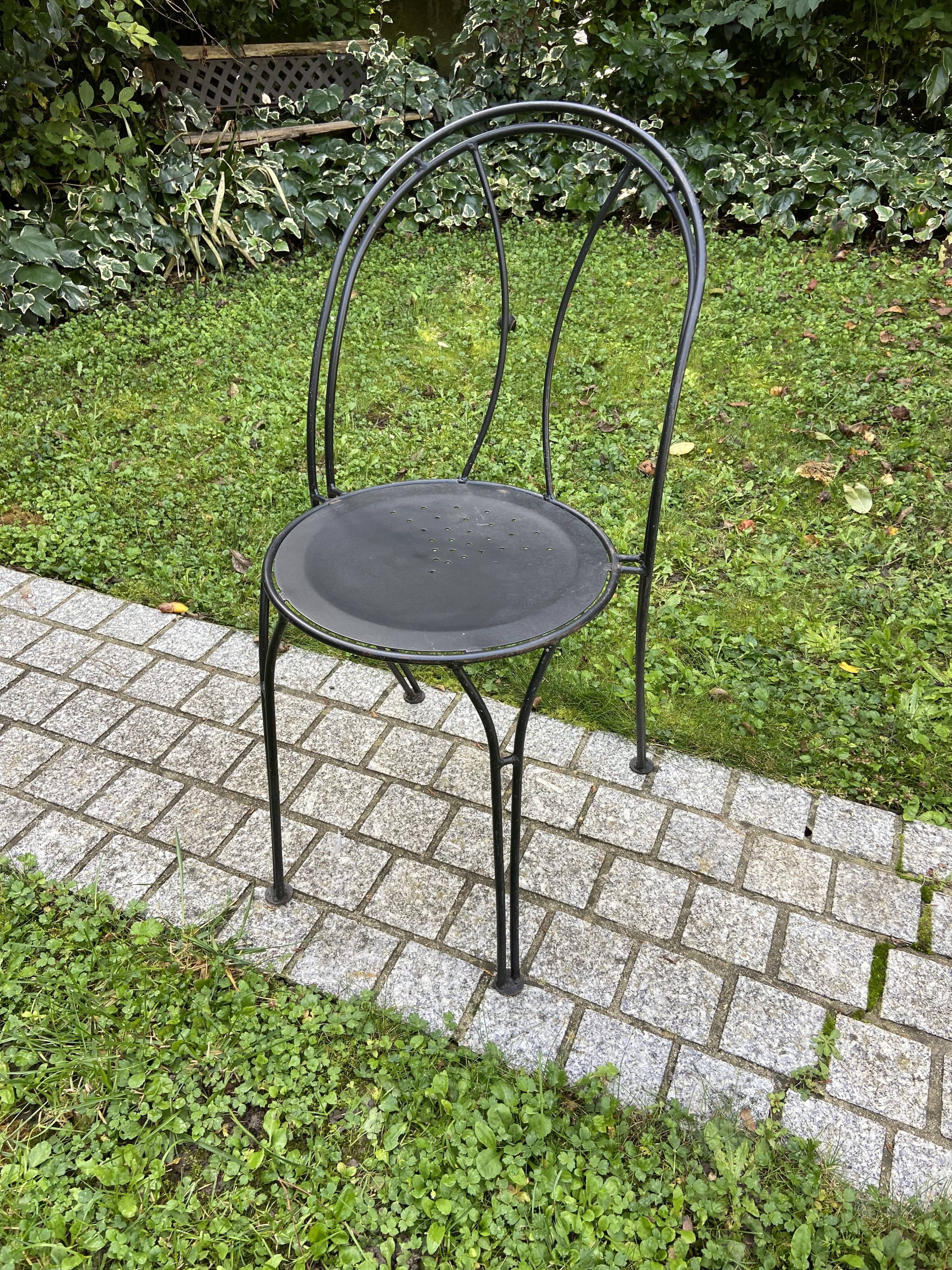 Black chair in vintage wrought iron 1980