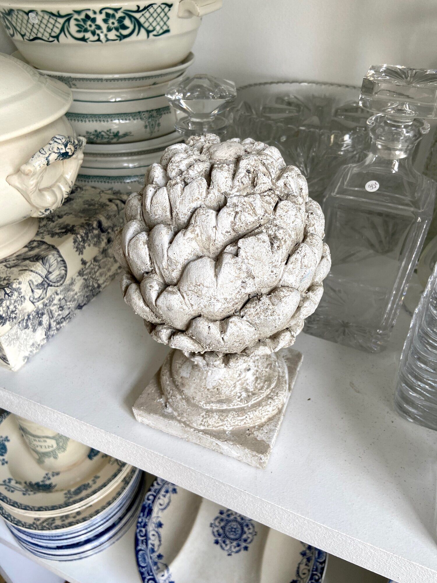 Ornamental artichokes in bleached concrete