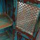 Old wooden cabinet with doors with grille