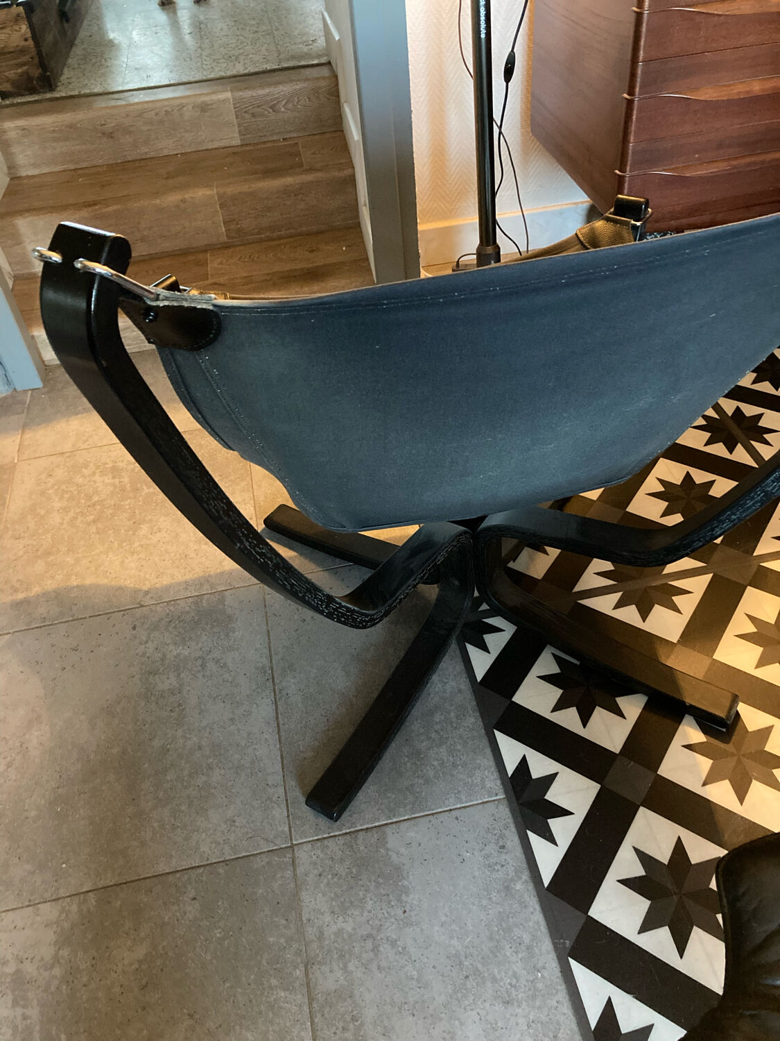 Leather Falcon armchair and footrest