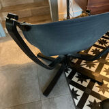 Leather Falcon armchair and footrest