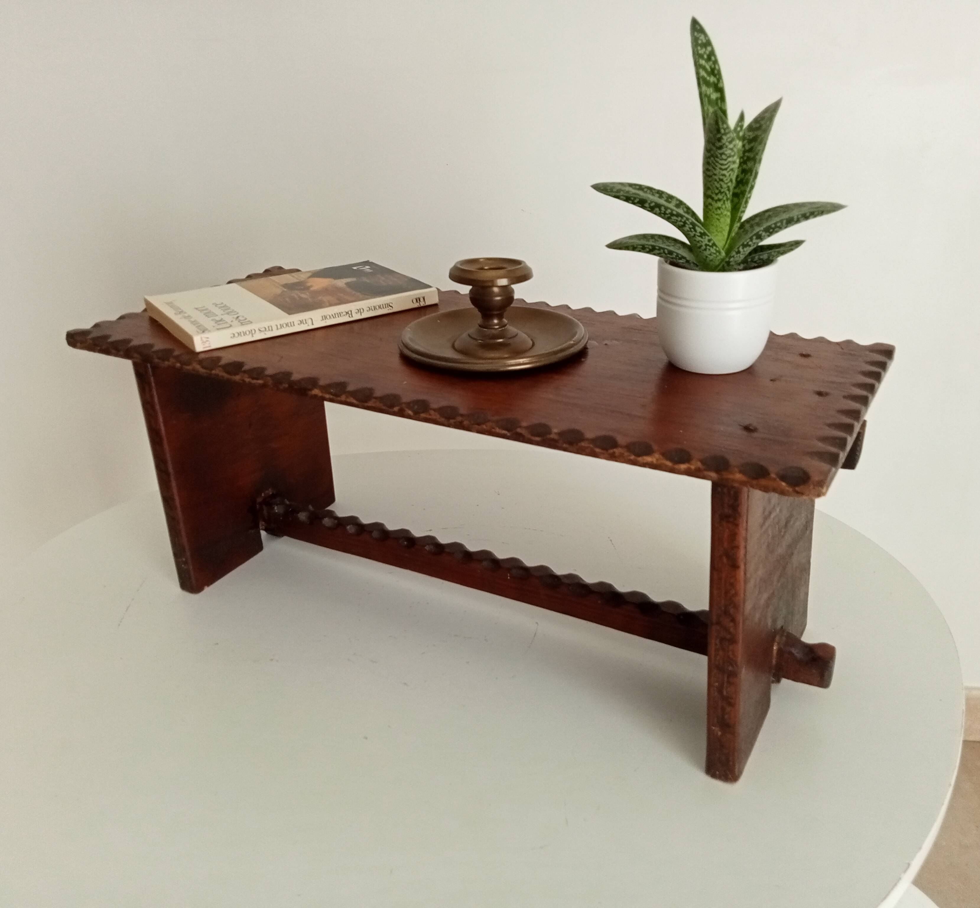 Low brutalist stool in the style of Charles Dudouyt.