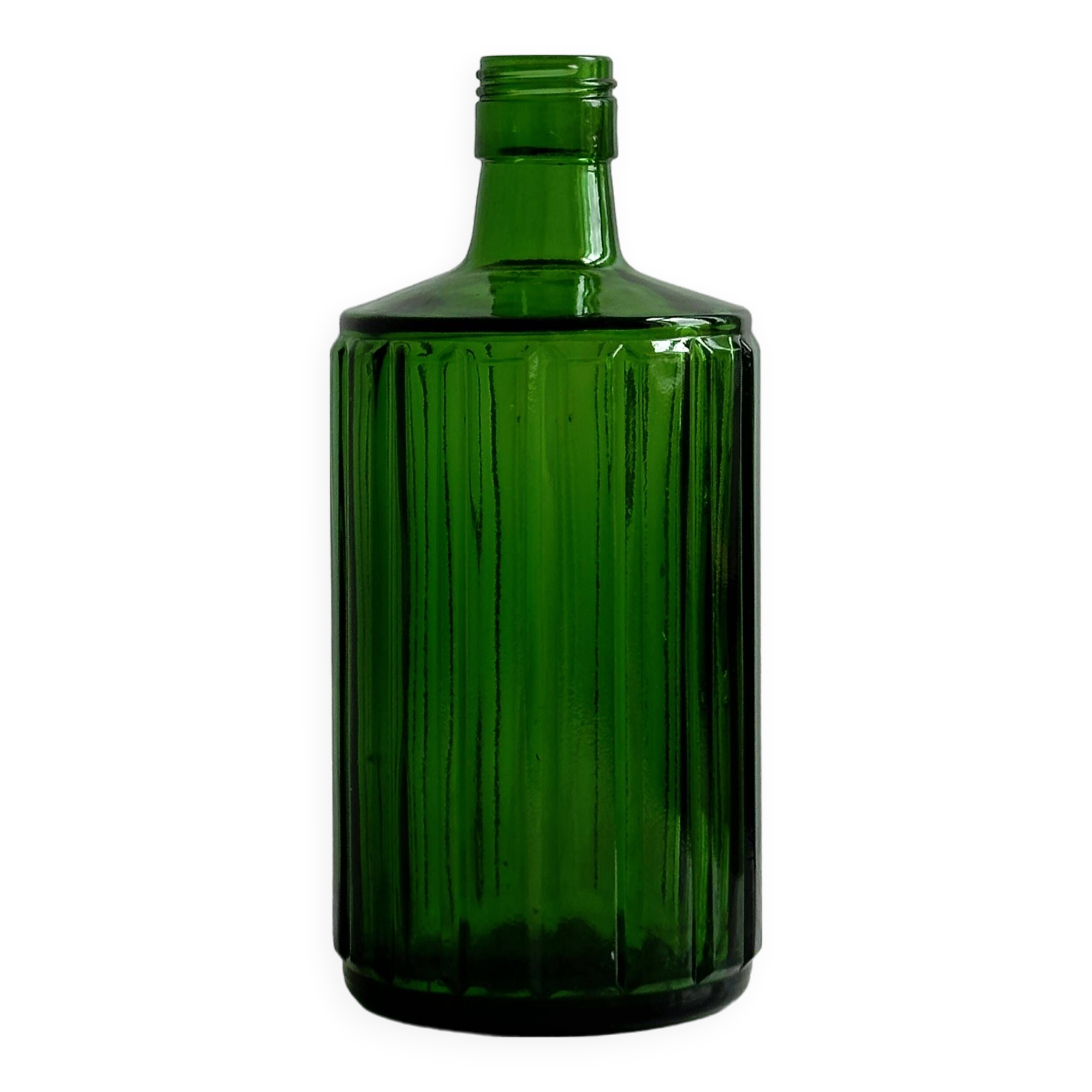 Green glass bottle, ribbed design.