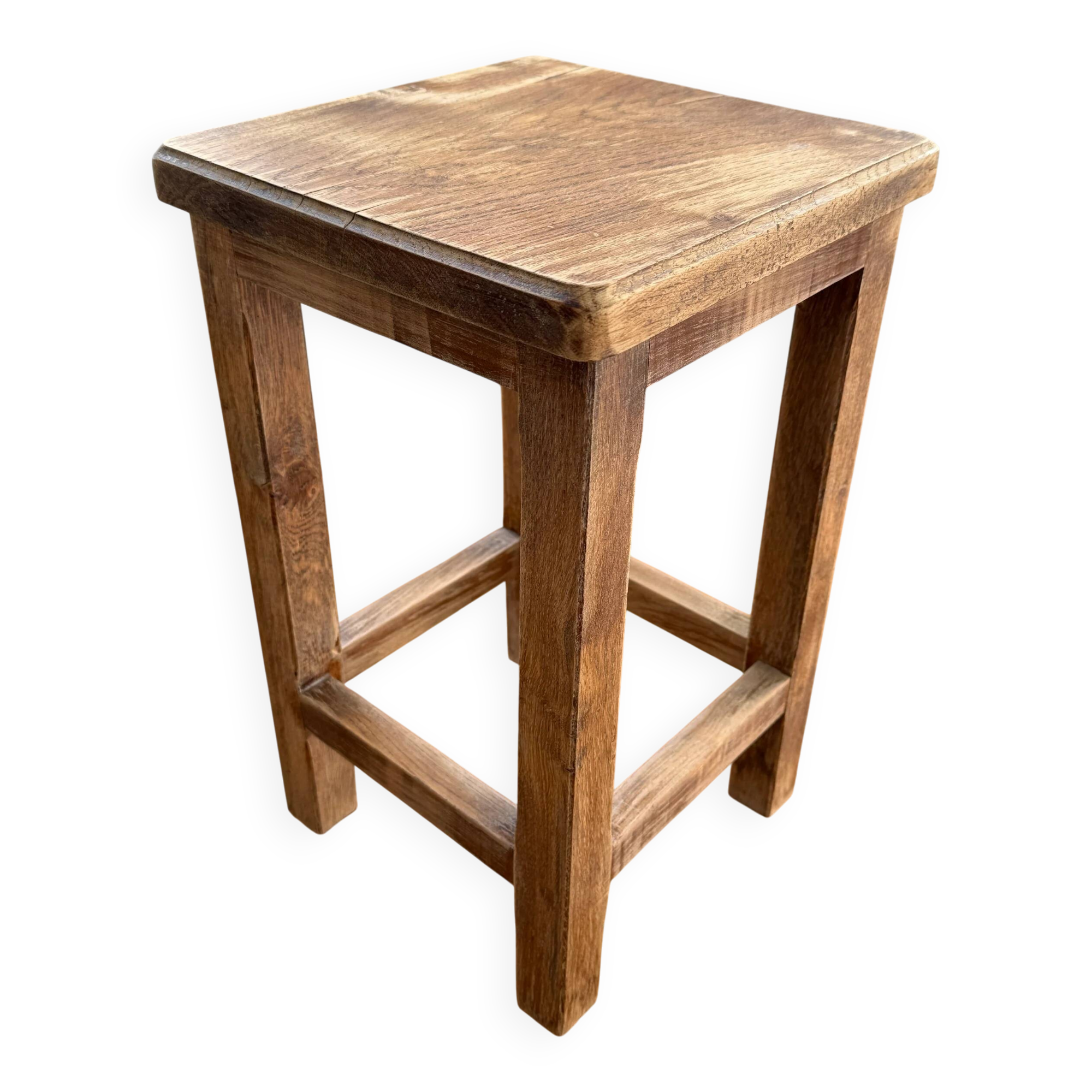 Brutalist stool in raw wood with a weathered effect.