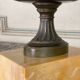 Bronze cup on a yellow Siena marble base, early 19th century.