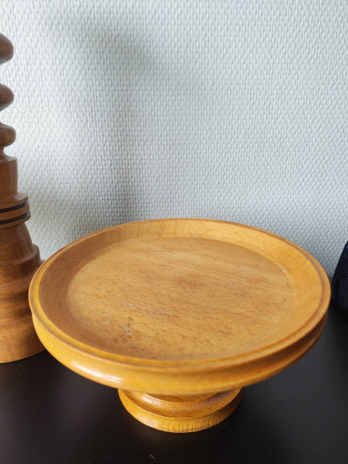 Vintage decor trio: candlestick and light wood bowls in Scandinavian style.
