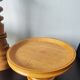 Vintage decor trio: candlestick and light wood bowls in Scandinavian style.