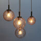 Four gold fleck globe pendants by Doria Germany