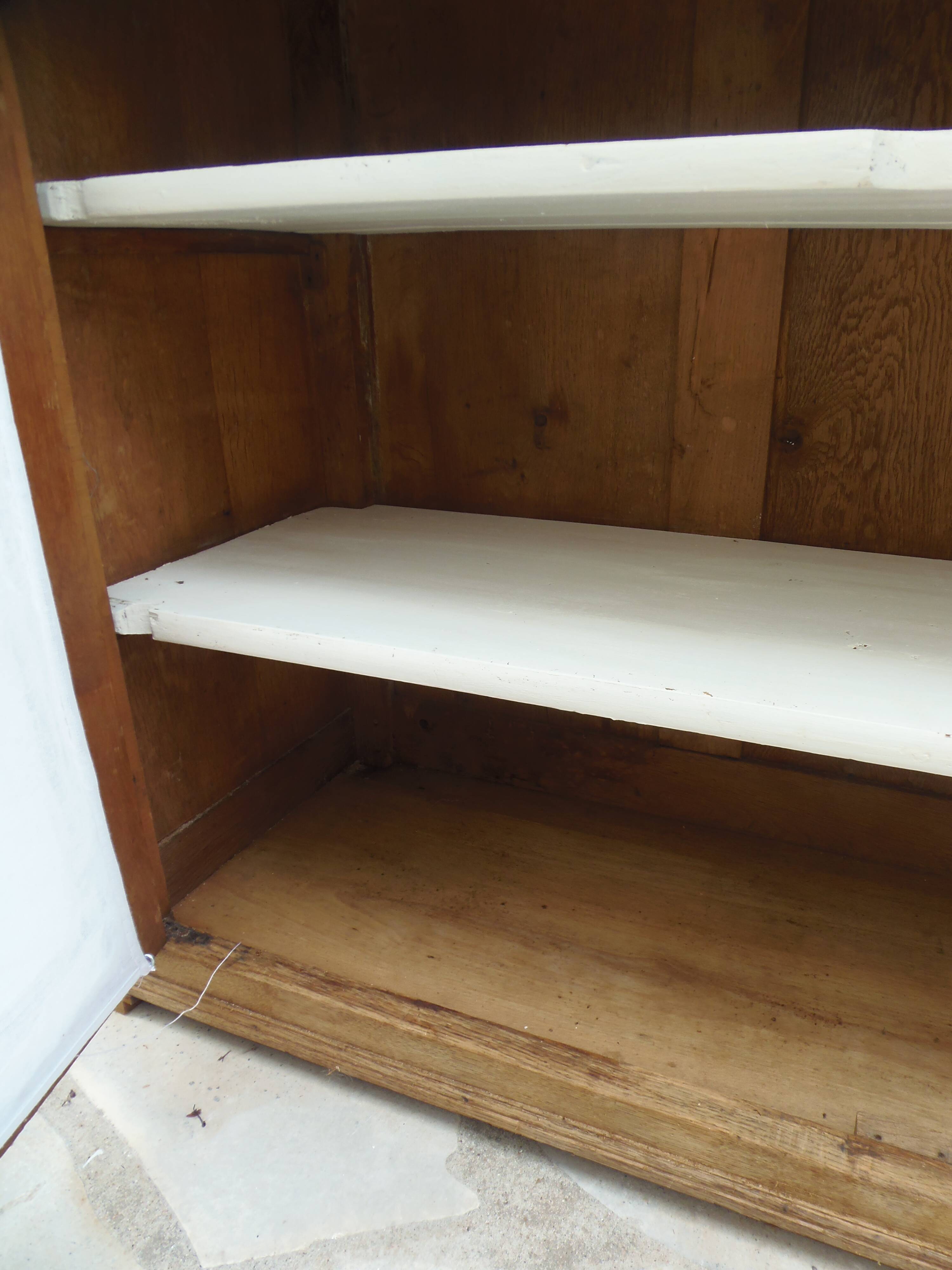 Antique wooden sideboard, fabric doors and pearl grey shelves.