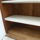 Antique wooden sideboard, fabric doors and pearl grey shelves.